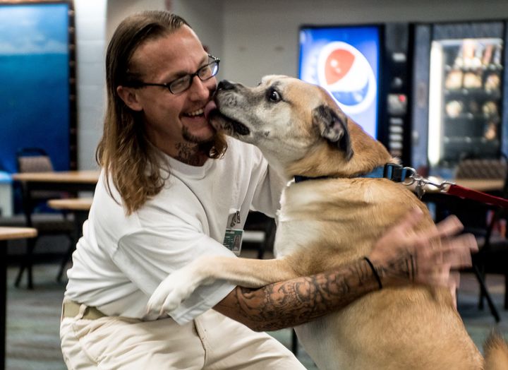 Inmate William Friedrichs with the pooch, Connor.