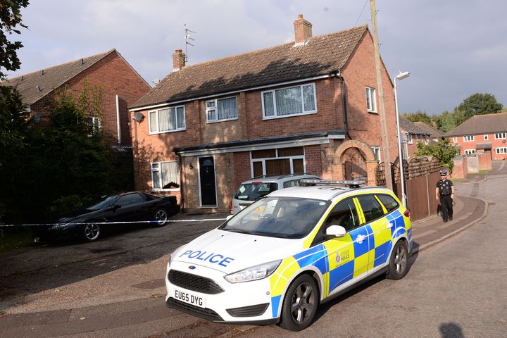 <strong>Police stand outside a house in Colchester, Essex, where a baby boy died after being attacked by a dog</strong>
