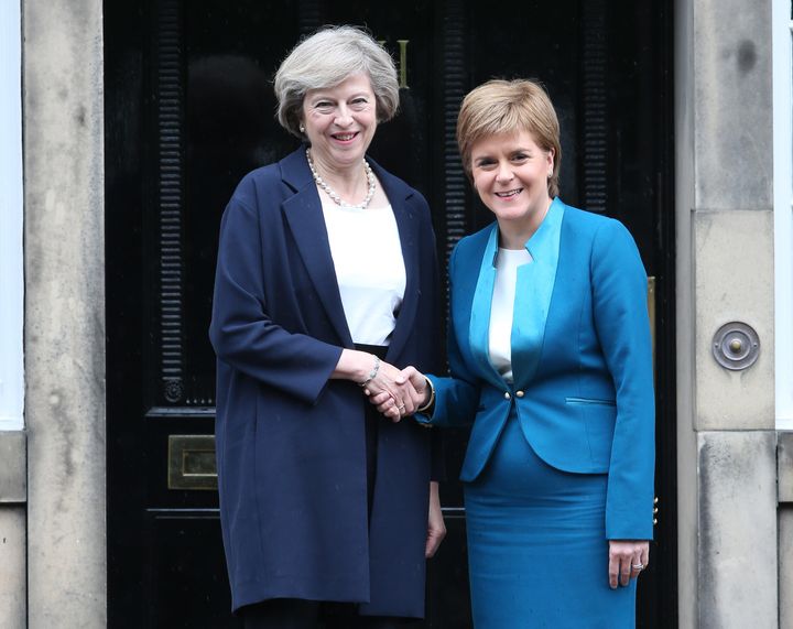 Prime Minister Theresa May (left) is greeted by Scotland's First Minister Nicola Sturgeon at Bute House in Edinburgh.