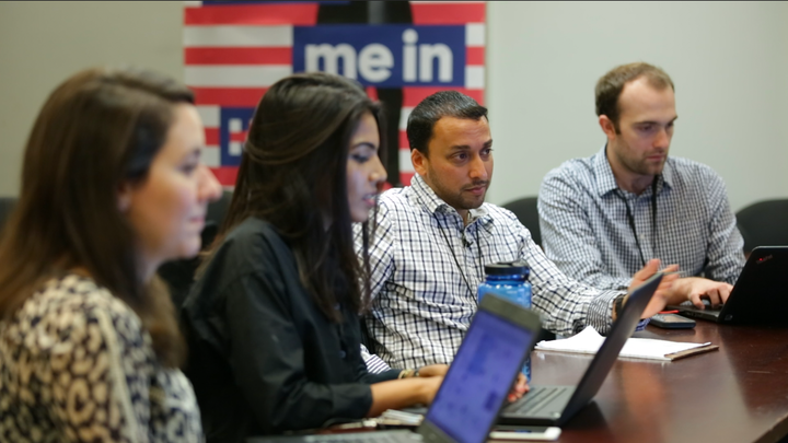 Zara Rahim, second from left, and Farooq Mitha, second from right, discuss Muslim outreach strategy in Hillary Clinton's Brooklyn headquarters.