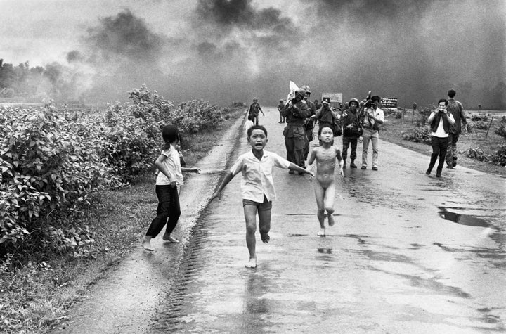 Vietnamese children flee from their homes in the South Vietnamese village of Trang Bang after South Vietnamese planes accidently dropped a napalm bomb on the village, located 26 miles outside of Saigon. Twenty-five years later, the young girl running naked from her village, Phan Thi Kim Phuc, was named UNESCO goodwill ambassador.