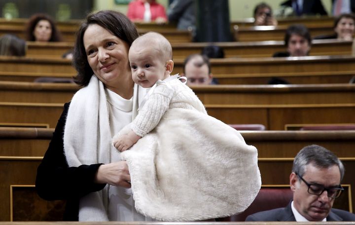 Spanish MP Carolina Bescansa holds her infant son Diego in Parliament.
