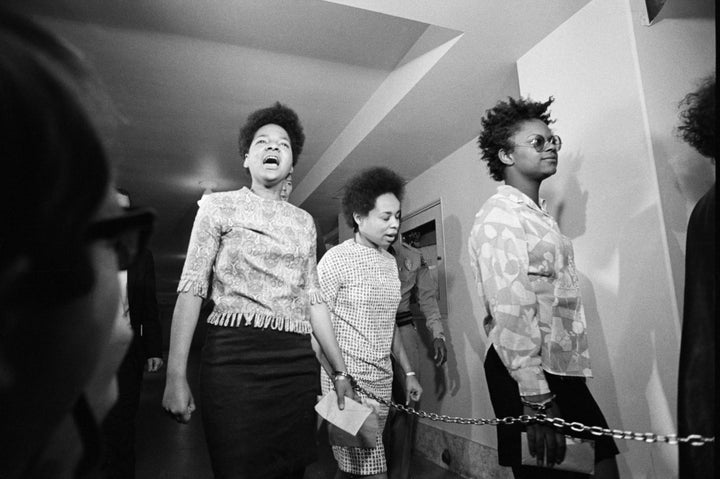 Three women members of the Black Panthers are led into court in Los Angeles. They were arraigned on charges stemming from a five hour gun battle with police at Panther headquarters on December 8. Thirteen Panthers were arraigned on charges of conspiracy to commit assault on police officers and illegal possession of firearms.