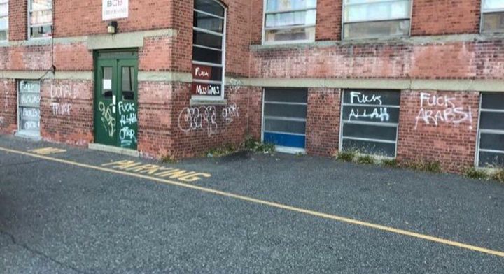 Police say a man named Jonathon Hussey wrote this Islamophobic graffiti on the Muslim Community Miraj Center in Bayonne, New Jersey. 
