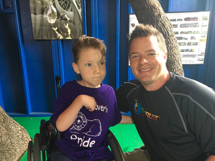 <p>Josh Bezoni with Make-A-Wish Kid, Hayden, in his new wheelchair-accessible treehouse they built for him.</p>