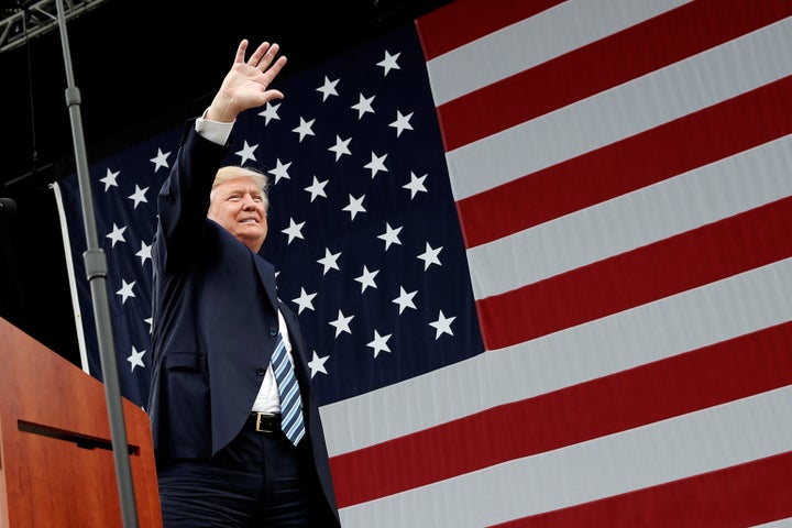 Republican U.S. presidential nominee Donald Trump waves to supporters at a campaign rally in Greensboro, North Carolina, U.S., October 14, 2016.