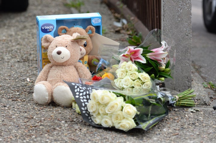 Floral tributes outside a house on the junction of Harwich Road with Tara Close in Colchester, Essex