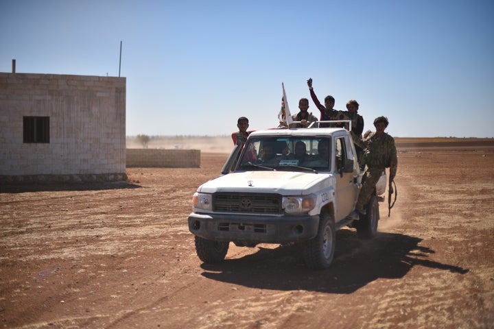 A convoy belonging to the Members of Free Syrian Army enters Dabiq, near Aleppo, after driving ISIS terrorists