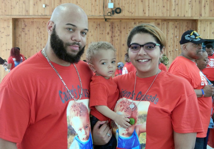 Caiden, who was born with sickle cell disease, with his parents.