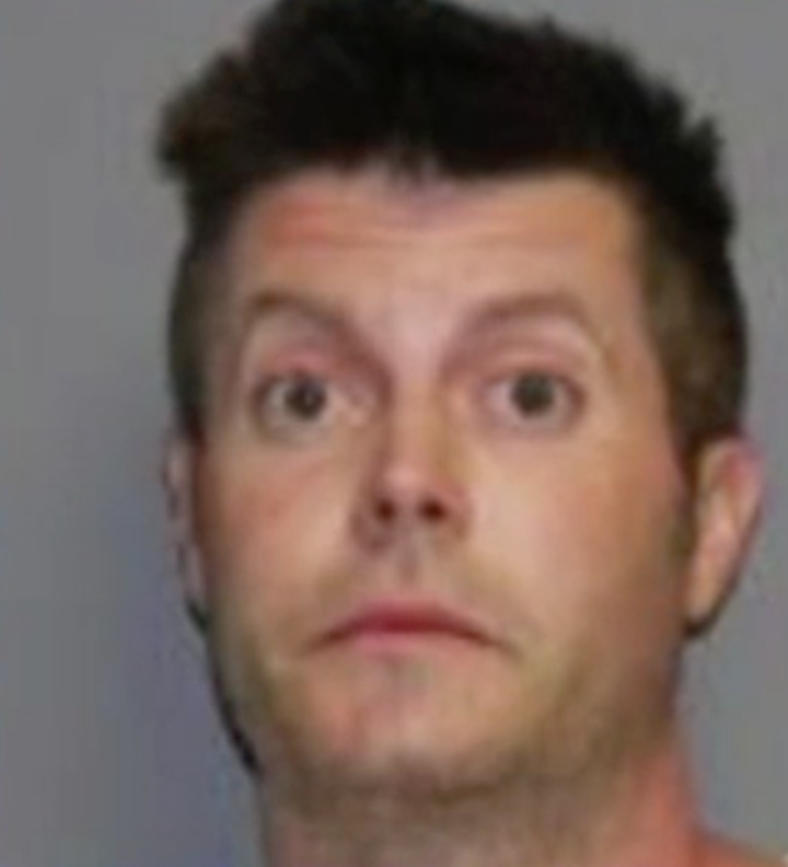 Police say Michael Orchard was tripping on LSD when he allegedly broke into his neighbor's home to rescue their dog from an imaginary blaze.