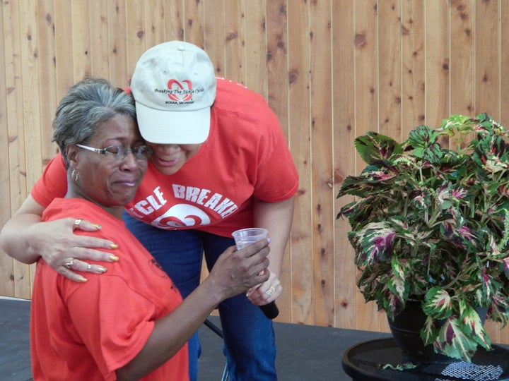 <p>Consoling Kimberly Foster as she grieves for her son, Dwight Foster, lost to sickle cell disease.</p>