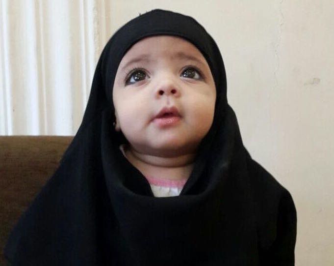 Warida and Nashwan's niece, who is&nbsp;cloaked in black fabric like many women and girls living under ISIS rule.