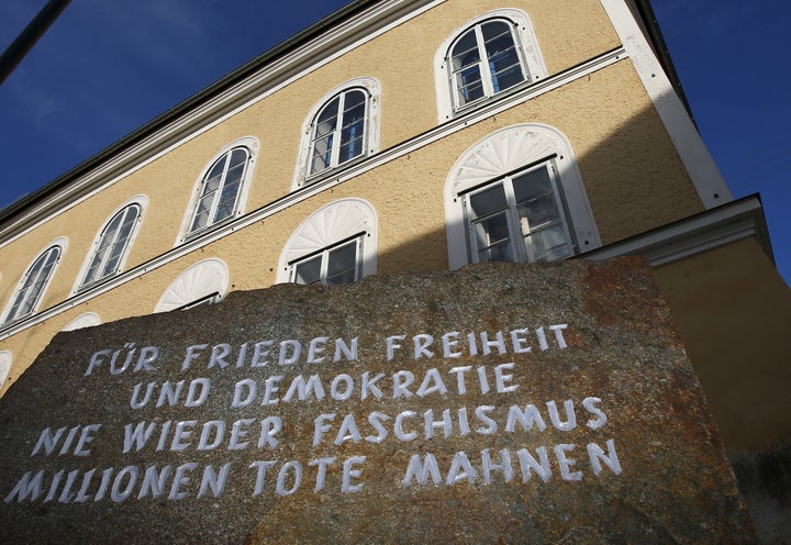 A stone outside the house in which Adolf Hitler was born, reads 'For peace, freedom and democracy, never again fascism, milli