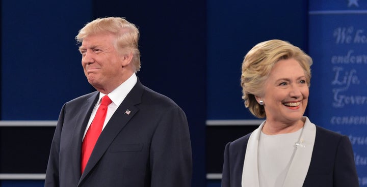 Donald Trump and Hillary Clinton arrive on stage for the second presidential debate on Oct. 9, 2016. 