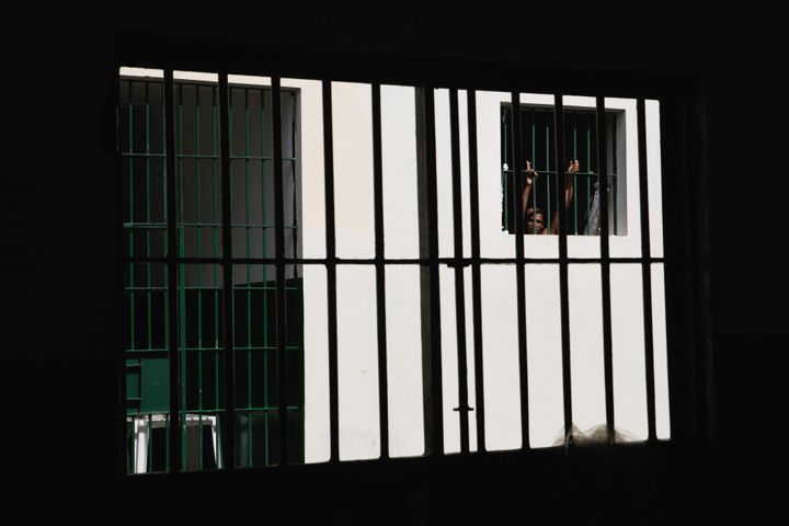 An inmate stands in his cell at the Anisio Jobim penitentiary complex on February 17, 2016 in Manaus, Brazil. Local media reported that a deadly riot occurred at the Penitenciária Agrícola de Monte Cristo in Boa Vista on Sunday.