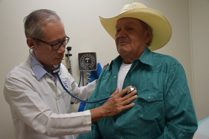 Dr. Duc Nguyen of the Al-Shifa health clinic, with a patient.