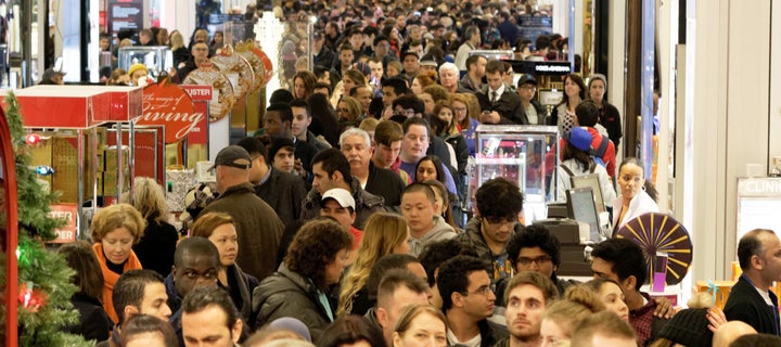 Shoppers crowd the aisles of Macy's department store in Herald Square, New York, on Nov. 26, 2015.