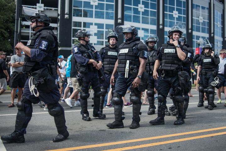 Police in riot gear walk outside Bank of America Stadium before a football game in Charlotte, North Carolina in September. Protests disrupted the city after an officer fatally shot Keith Lamont Scott, a 43-year-old black man.