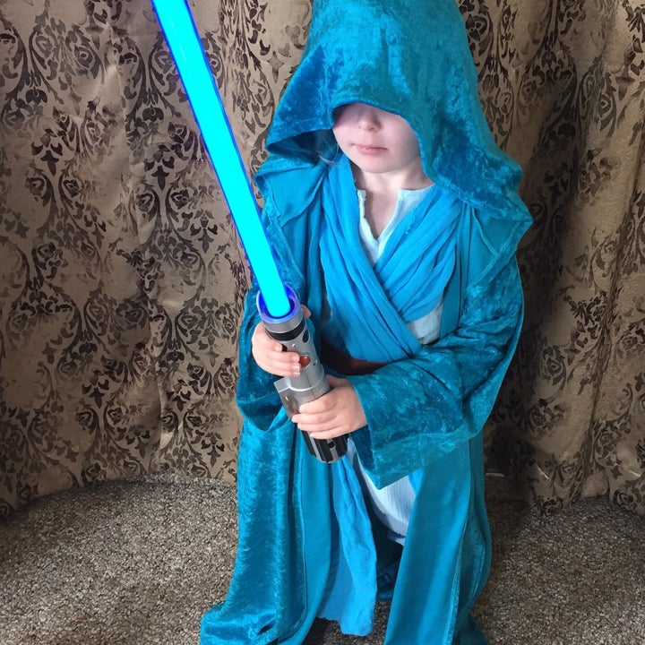 Of course Jedi Elsa Rey has a blue lightsaber.