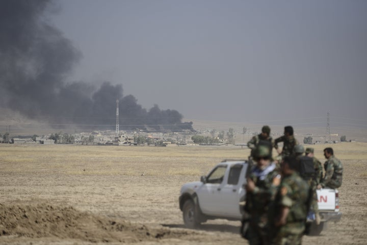 Smoke rises over Tarjala village Monday as Peshmerga forces attack ISIS targets during an operation to liberate Mosul.