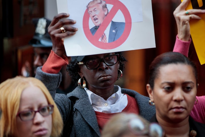 Activists protest Republican presidential nominee Donald Trump in front of Trump Tower in New York City on Monday.