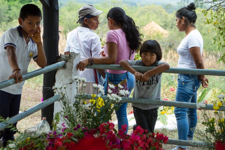 During an indigenous peace march just weeks after signing the accord family members take the opportunity to mourn an indigenous leader who was killed during the conflict