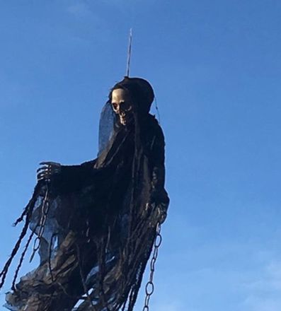 The spooky prank involved a fake skeleton ghost with chains and a raggedly black cloak.