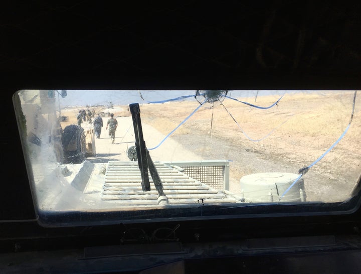 The view from inside of a Peshmerga armored, mine-resistant “Badger” vehicle.