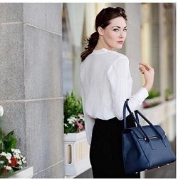A model carries a blue Jardine of London handbag