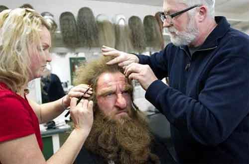 Peter Swords King (right) works with an associate on a character make-up for "The Hobbit."