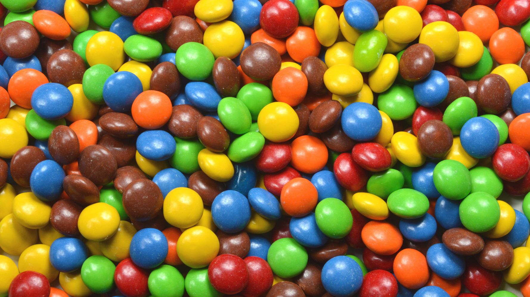 M m фото. Candy m m's. Цветные крошки м m& m. M&M фон. M&M фон цвет.