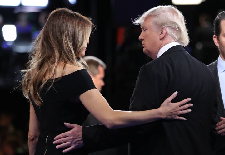 Melania Trump, standing by her man. 
