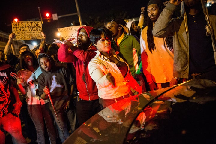 Baltimore’s police department tracks the cell phone use of residents and films their movements using drones. Here, people in the city protest the death of Freddie Gray on April 30, 2015. 