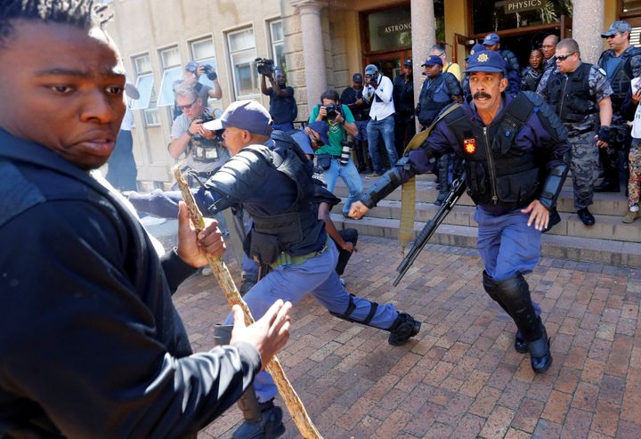 University of Cape Town students clash with police as stun grendes are used during protests demanding free tertiary education in Cape Town, South Africa, October 17, 2016.
