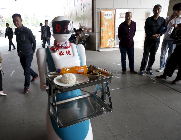 A robot works as a waitress for a restaurant in Xi'an, Shaanxi Province, China, April 20, 2016.