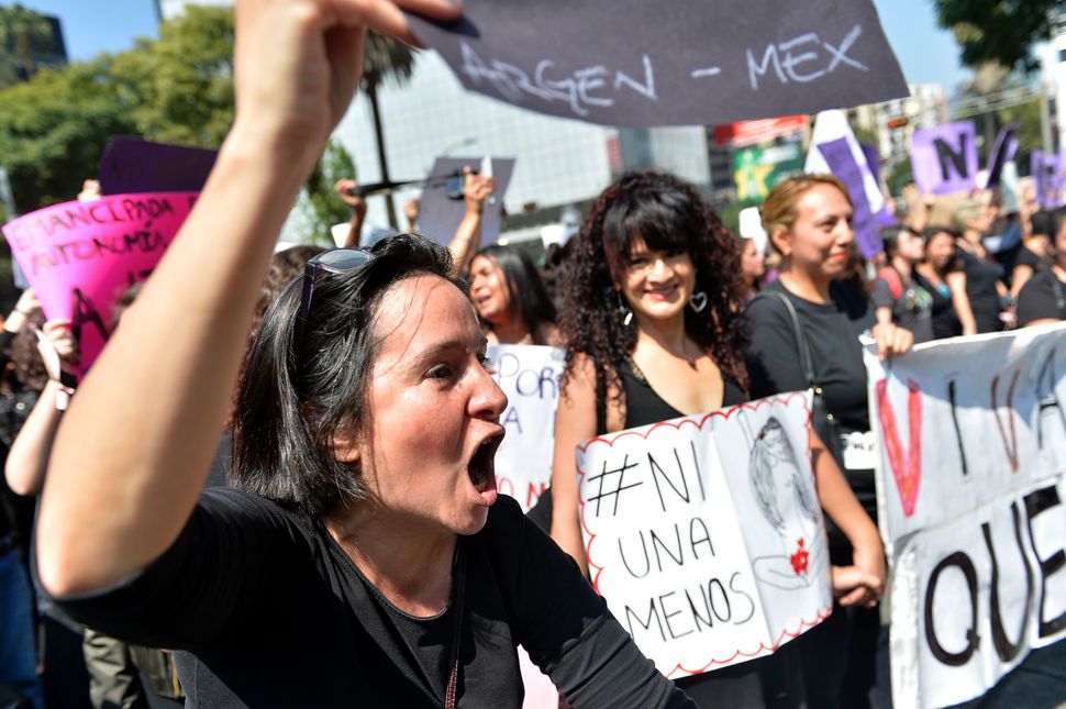 27 Powerful Images Of Women Protesting Against Femicide In Latin