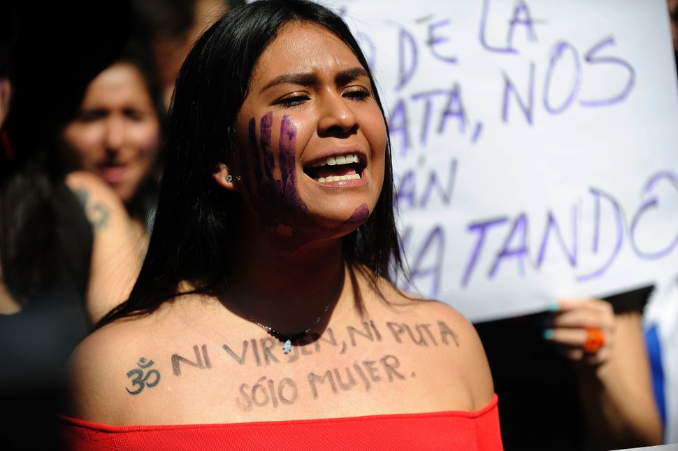 27 Powerful Images Of Women Protesting Against Femicide In Latin