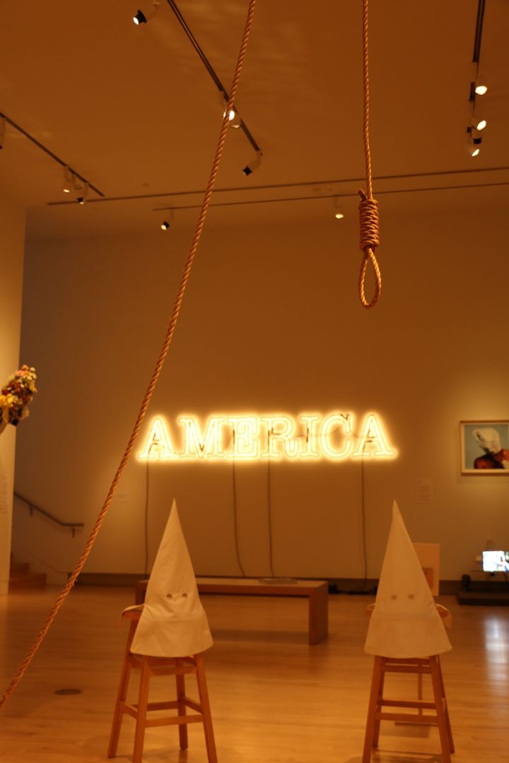 Duck, Duck, Noose by Gary Simmons and America by Glenn Ligon meld together in 30 Americans, on display at the Tacoma Art Museum in Tacoma, Washington