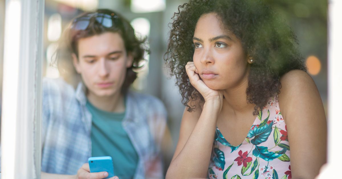 Dating other people. Bad partner. A guy looking unhappy.