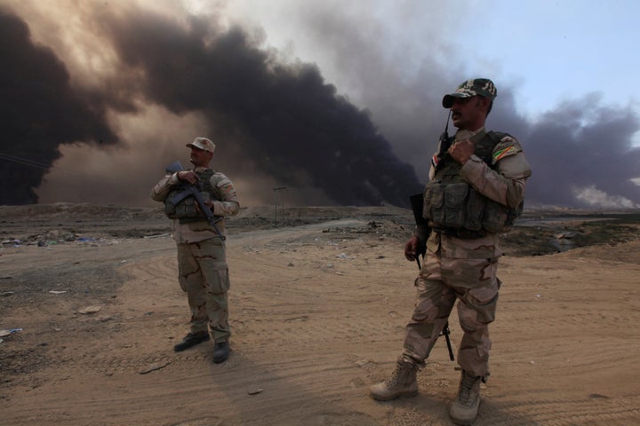 Members of the Iraqi army in the Iraqi town of Qayyarah during an operation to attack Islamic State militants in Mosul, Iraq,