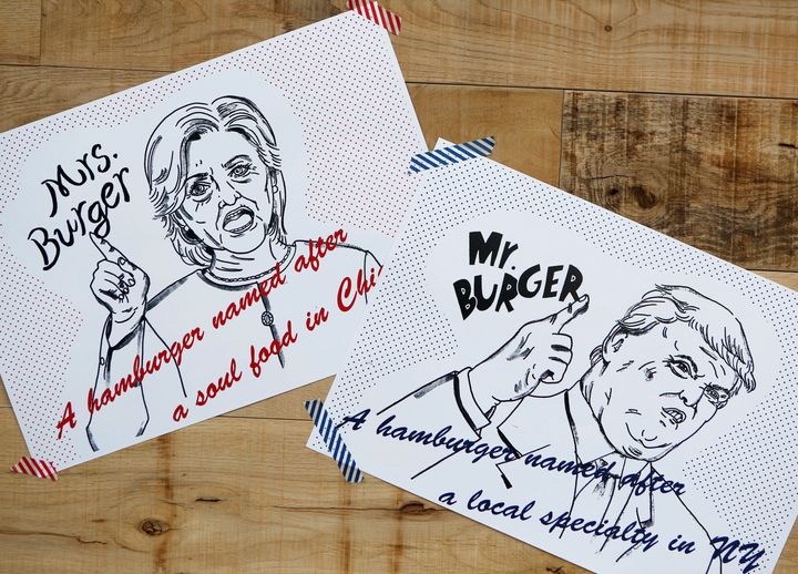 Campaign posters of Mr. and Mrs. Burger featuring U.S. presidential candidates Hillary Clinton and Donald Trump are displayed at J.S. Burgers Cafe in Tokyo, Japan October 7, 2016. Donald Trump and Hillary Clinton inspired burgers are being served up at a restaurant in Japan ahead of the US Presidential Election.