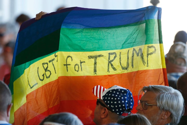 Supporters hold up a gay pride flag for Republican presidential nominee Donald Trump on Oct. 18, 2016, in Grand Junction, Colorado.