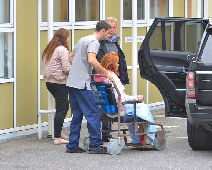 Sandra was pictured in a wheelchair beside her husband Harry on Thursday outside a hospital in Poole, Dorset