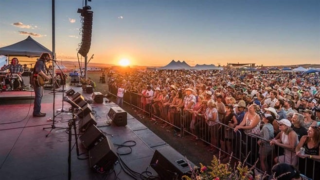 Hayes Carll performing at the 2016 Red Ants Pants Music Festival in White Sulphur Springs, Montana. Some small towns are looking to the arts as a way of attracting money and people.