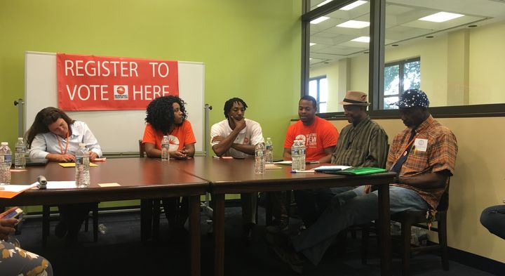 Tammie Hagen (far left) and Abdul-Rahman (far right) join a panel of former felons to talk to press about the restoration of rights, and New Virginia Majority's efforts to help ex-felons register to vote. 
