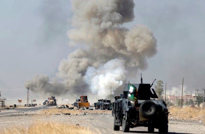 An IED planted by ISIS fighters explodes in front of Iraqi special forces vehicles in Bartella, east of Mosul.