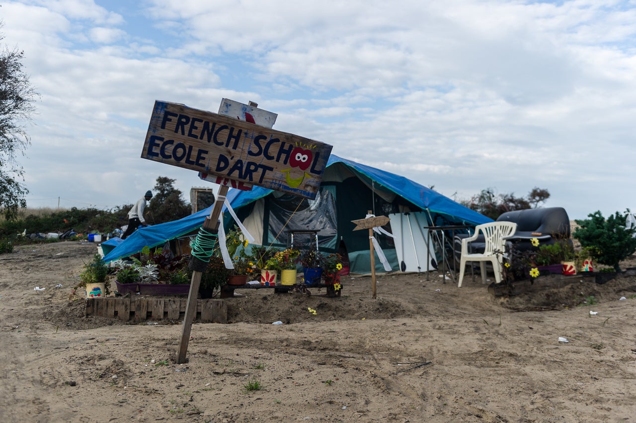 A handmade sign advertises an art school in the Calais Jungle on Oct. 16, 2016.