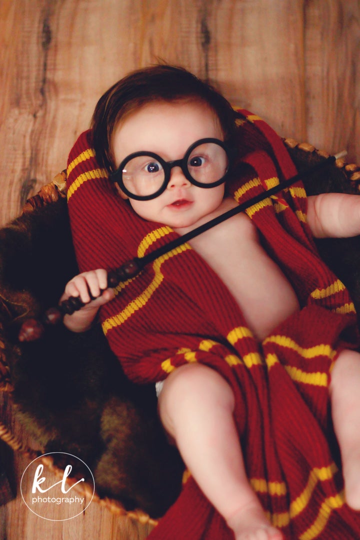 The photographer gathered all her Harry Potter books and props for the photo shoot.