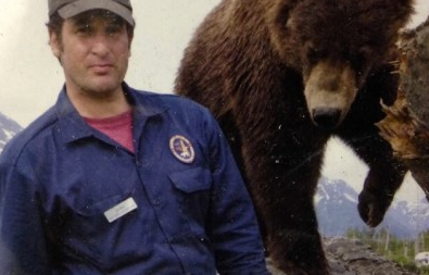 Dr. Jordan Schaul with a Kodiak brown bear cub