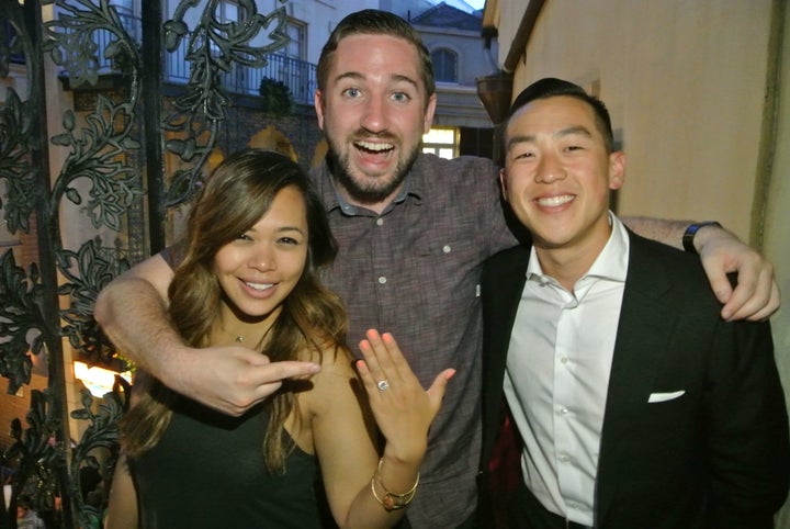 The couple posing with Tim, who helped orchestrate the proposal. 